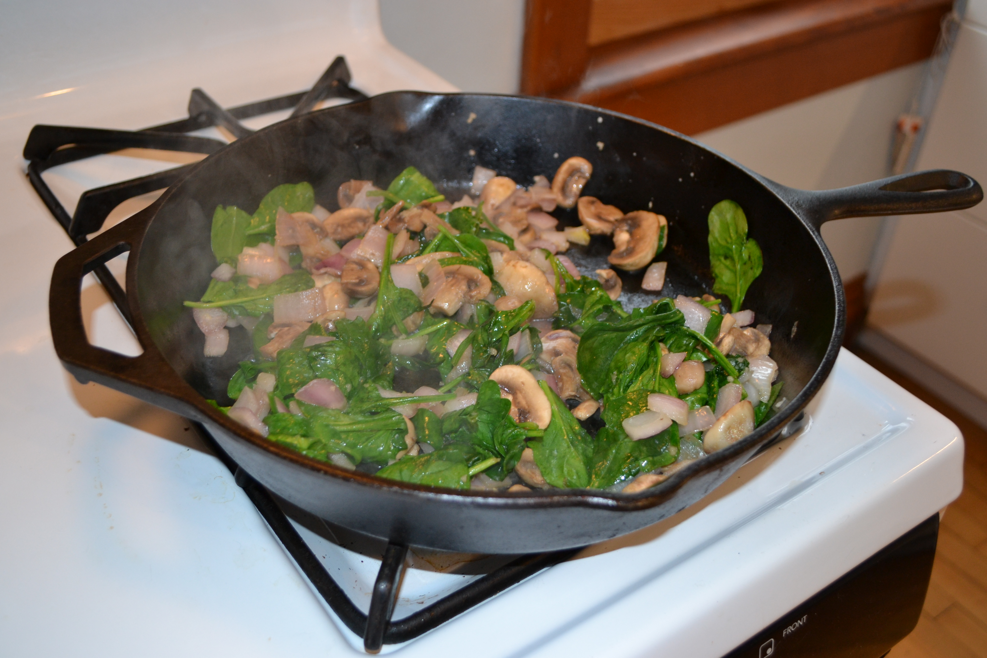 Cooking mushrooms and spinach